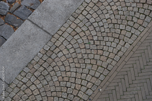 Cuadros en Lienzo Background construction of cobblestone and herringbone pattern at the sidewalk