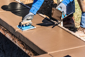 Wall Mural - Construction Worker Using Hand Groover On Wet Cement Forming Coping Around New Pool