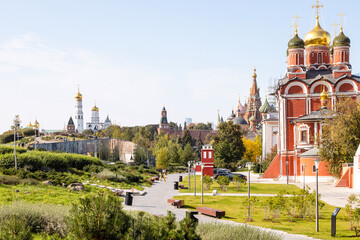 Wall Mural - cathedral of Znamensky monastery in the Old Tsar's yard in Zaryadye urban landscape public park on Varvarka street and view of Kremlin on background in Moscow city on sunny September day