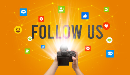 Using camera to capture social media content with FOLLOW US inscription, social media content concept