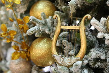 Golden Harp Christmas Ornament. Christmas Decorations On The Christmas Tree. Selective Focus.