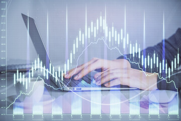 Double exposure of businesswoman hands typing on computer and forex graph hologram drawing. Financial analysis concept.