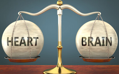 Wall Mural - heart and brain staying in balance - pictured as a metal scale with weights and labels heart and bra