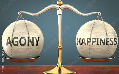 Fotografía agony and happiness staying in balance - pictured as a metal scale with weights