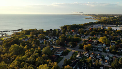 Wall Mural - Aerial drone view of suburban neighborhood on the shoreline of Lake Michigan. Establishing shot of American suburb, street. Residential houses in Milwaukee, Wisconsin