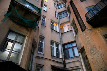 Poster - residential stone old house in the city in the evening