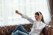 © surachetkhamsuk - Young Asian woman enjoy listening to music with headphones, happy and relaxing time