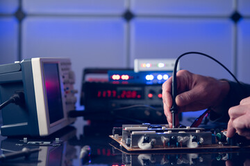 Poster - Debugging electronics device. PCB witch microcontroller in electronics laboratory