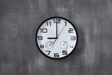 Canvas Print - clock at wall background surface