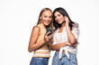 © F8  \ Suport Ukraine - Two surprised young women using mobile phone together over white background