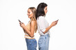 © F8  \ Suport Ukraine - Young two women with phones turned each other's backs isolated on white background
