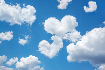 Sticker - Bright picture of clouds in shape of two hearts between other clouds in blue sky. Concept of love, feelings, relationship between people