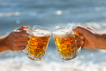 Wall Mural - hands with mug of beer making toast