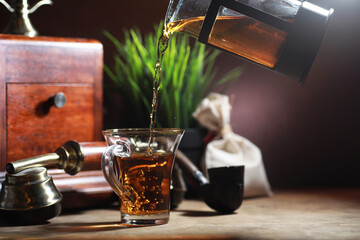 Wall Mural - Brewing tea on a wooden table