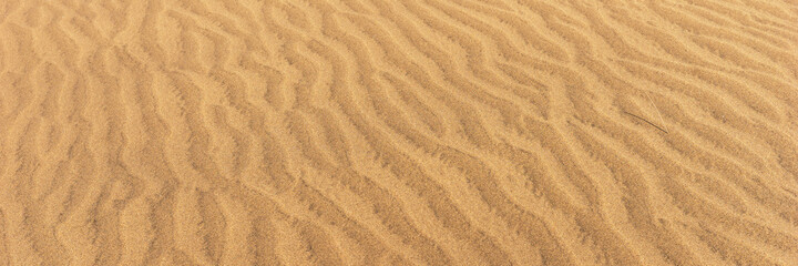  Panoramic sandy background. Sand on the beach formed by wind