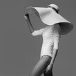A graceful woman posing with a large wide-brimmed hat. Black and white image.