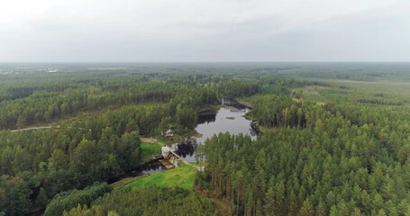 Wall Mural - Aerial footage of dam with lake and river. Autumn landscape. Sunset.