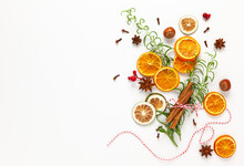  Christmas Composition With Cookies, Dried Oranges, Cinnamon Sticks And Herbs On White Background. Natural Food Ingredient For Cooking Or Christmas Decor For Home. Flat Lay.