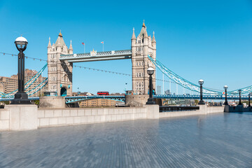 Wall Mural - Tower Bridge in London with empty riverside walk due to coronavirus lockdown - London famous postcard view without people and tourists in the covid-19 era - architecture and travel