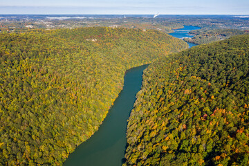 Aerial drone image of the Cheat River flowing through narrow wooded gorge in the autumn towards Cheat Lake near Morgantown, WV