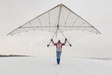 Girl Holds An Old Hang Glider Wing.