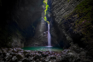 Canvas Print - Beautiful waterfall in the dark cave.