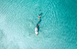 © AmazingAerialAgency - Aerial View Of Person Swimming With Horse In The Ocean, Colombia