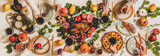 Fototapeta Kuchnia - Autumn Thanksgiving, Friendsgiving, family party dinner. Flat-lay of peoples hands with wineglasses celebrating over table with roasted duck, vegetables, cheese board and apple pie, top view