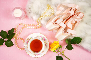 Wall Mural - Pointe Ballet Shoes Aesthetic theme desktop workspace background on stylish pink textured background. Top view blog hero header creative composition flat lay.