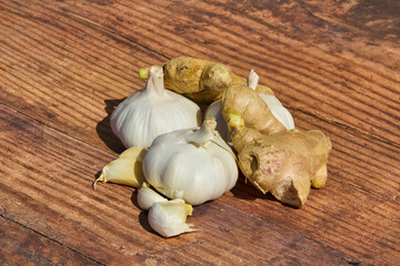 Wall Mural - Closeup shot of the ginger and the garlic on the wooden surface