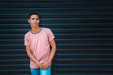 portrait of young man in pink shirt