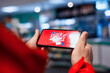 © vadish - A man holds a smartphone in his hands with an inscription on the display Super Sale.