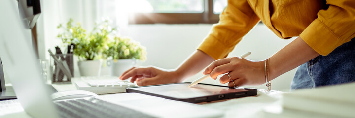 Fototapete - Artist or creative designer drawing on digital tablet with new project design.