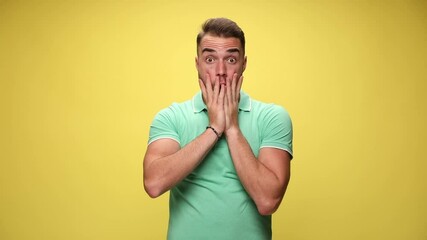 Poster - handsome shocked casual guy slapping his face, puffing his cheeks and can not believe the situation on yellow background