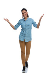 Wall Mural - smiling smart casual woman welcoming and walking