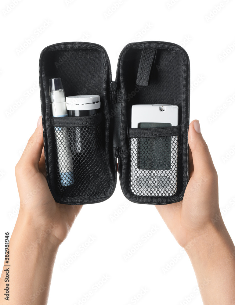 Female hands with glucometer and lancet pen in bag on white background. Diabetes concept