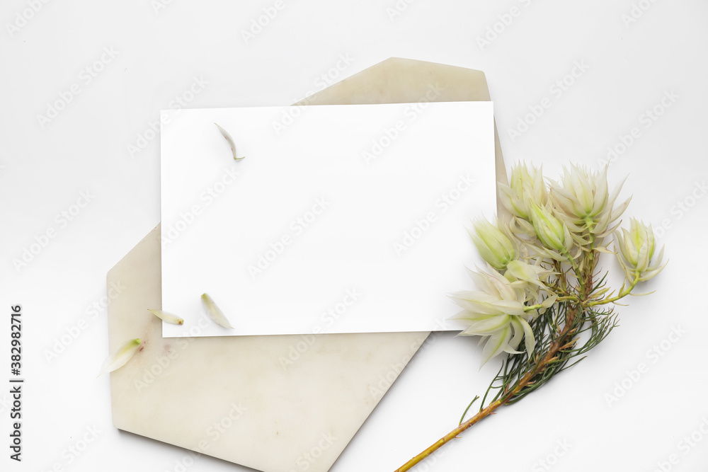 Composition with blank card on white background