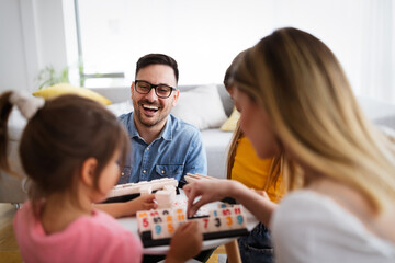 Wall Mural - Happy family having fun time at home