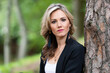 © ako-photography - portrait of a beautiful young woman posing near a tree