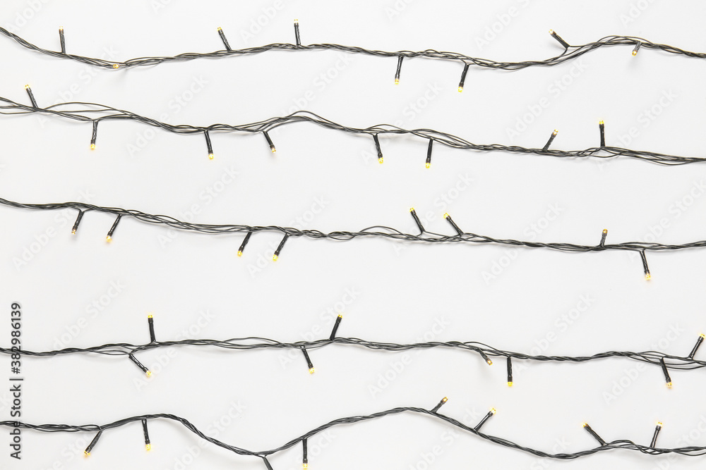 Christmas lights on white background