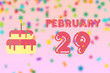 © SergeVo - february 29th. Day 29 of month,Birthday greeting card with date of birth and birthday cake. winter month, day of the year concept