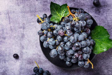 Wall Mural - black grape with green leaves