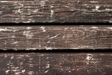 Old shabby wooden scratched surface painted in brown color