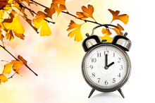 Vintage Clock And Autumn Colors Leaves. Fall Daylight Savings Time Change Concept