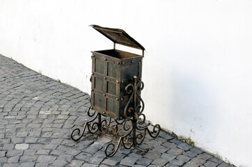 Garbage can with forged patterns.