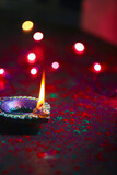 Fototapeta Las - happy diwali or happy deepavali greeting card made using a photograph of diya or oil lamp