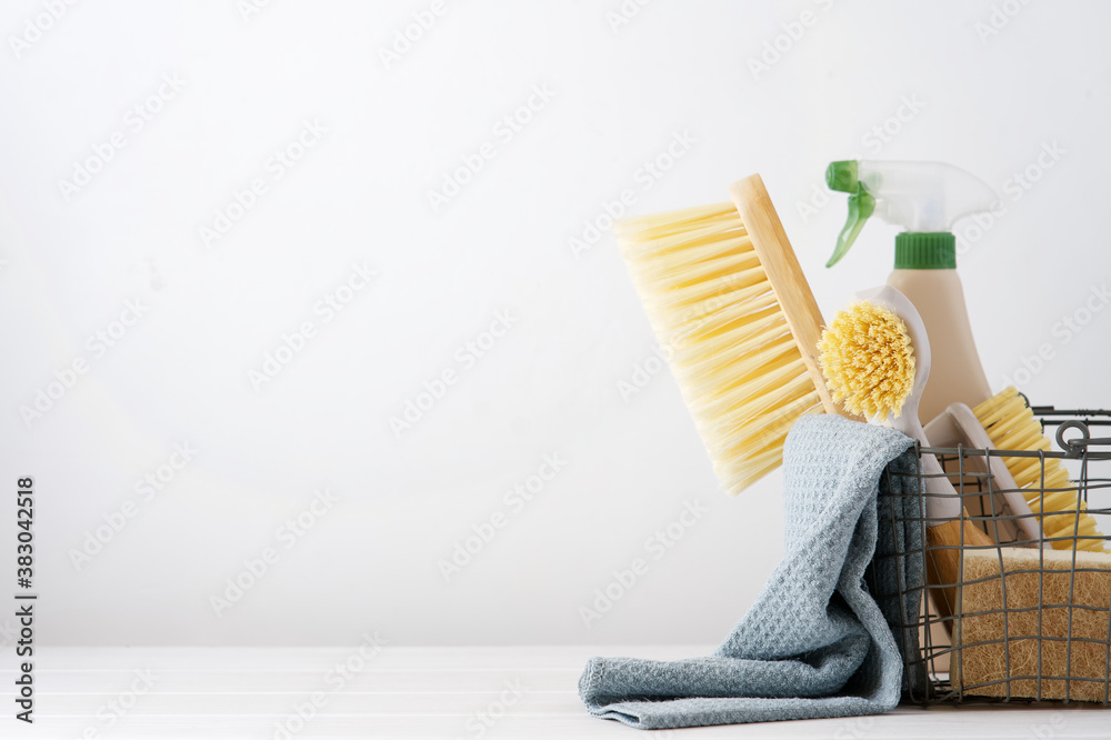 Eco brushes, sponges and rag in cleaning basket. Cleaner concept on white background - obrazy, fototapety, plakaty 