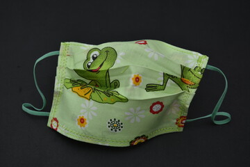 Wall Mural - green  cotton masks with  frogs