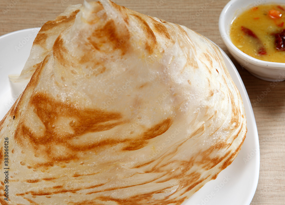Roti tissue, roti tisu, or tissue prata is a sweet flatbread often sold at Malaysian Mamak stalls. 