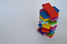 Colored Rectangles Made Of Wood, Collected In A Tower On A White Background.
Pink, Orange, Blue, Purple, Blue, Yellow, White, Red, Light Green.
View From Above